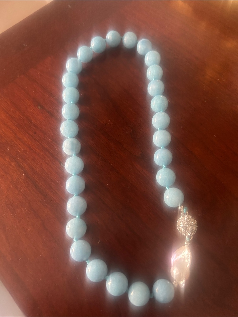 Light blue genuine aquamarine and pearl necklace. Strung in silk.’20 inches